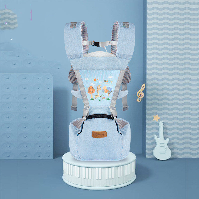 Light blue baby carrier with playful animal designs on the back, displayed against a blue-themed room with wavy curtains and musical decor elements.