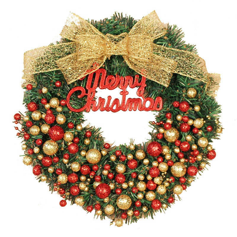 Festive Christmas wreath with a gold bow, red "Merry Christmas" sign, and an arrangement of red and gold ornaments on green foliage.