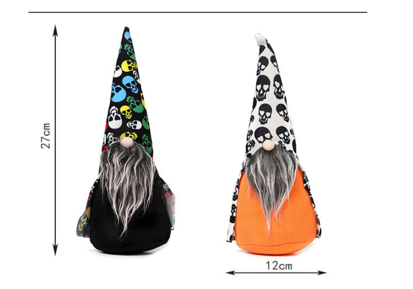 Two gnome figurines stand side by side, each with a tall pointed hat, long gray beard, and a beige nose. The left one has a colorful skull-patterned hat and black body, while the right features a black skull-patterned hat and orange body. Dimensions are marked as 27 cm tall and 12 cm wide.