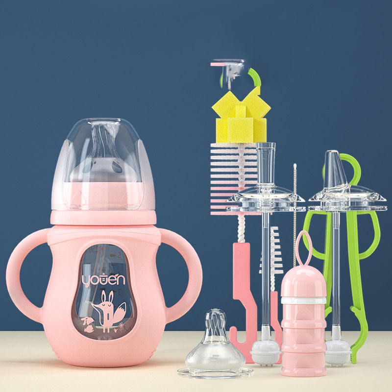 Pink baby bottle with animal design, surrounded by bottle cleaning brushes, sponges, and accessories in varying colors with a blue background.