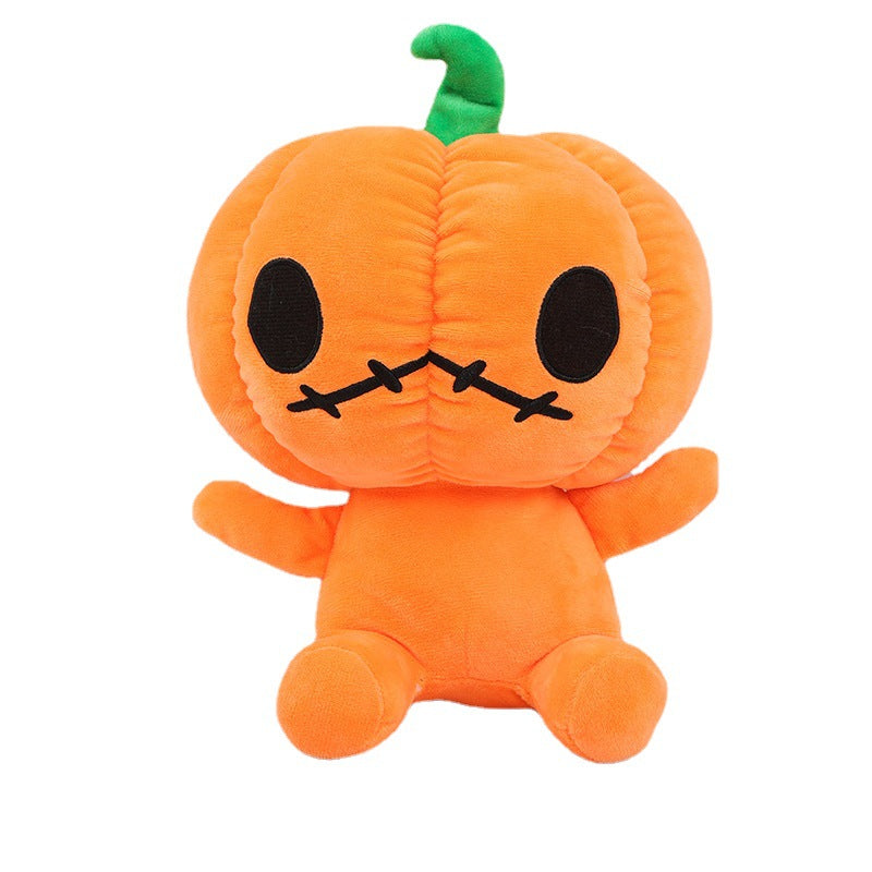 Cute plush toy with an orange pumpkin-shaped head, featuring black stitched eyes and mouth, and a small green stem on top. The body is soft and round.