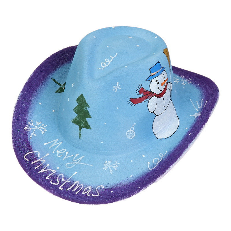 Blue cowboy hat with purple brim featuring a snowman, Christmas trees, snowflakes, and ornaments. "Merry Christmas" is written on the brim.