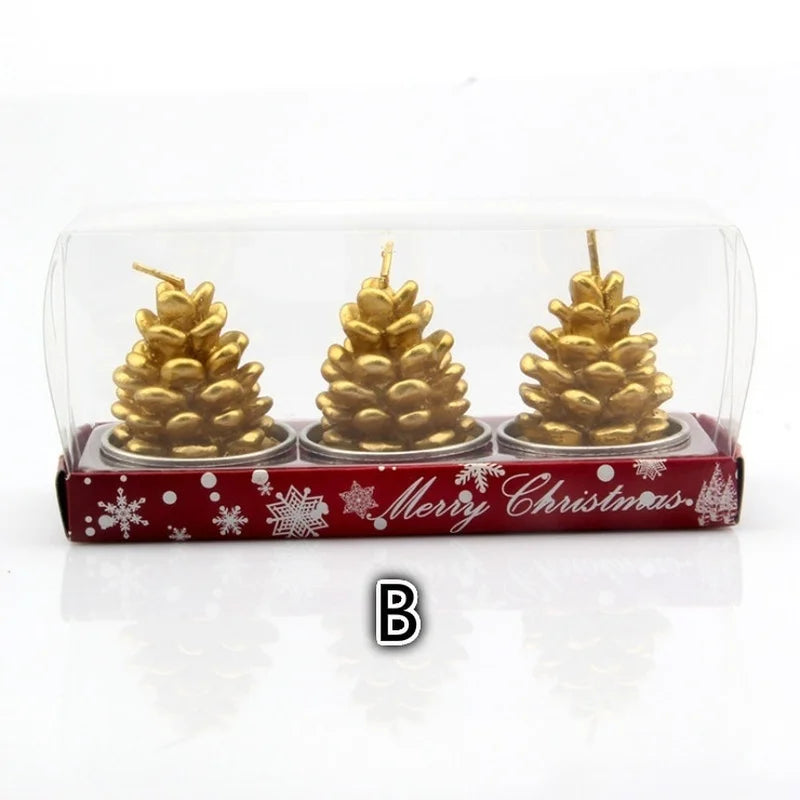 Three gold pinecone-shaped candles in a festive red box with snowflakes and "Merry Christmas" text, encased in a clear plastic cover.