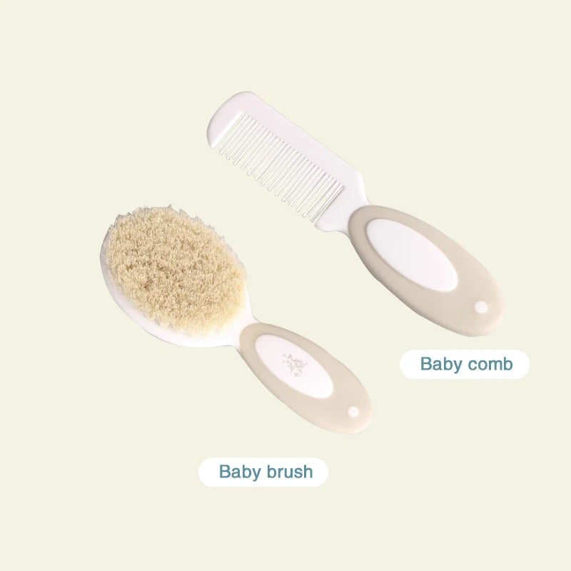 A beige and white baby brush with soft bristles is accompanied by a matching baby comb with fine teeth, both with oval handles, labeled as "Baby brush" and "Baby comb."