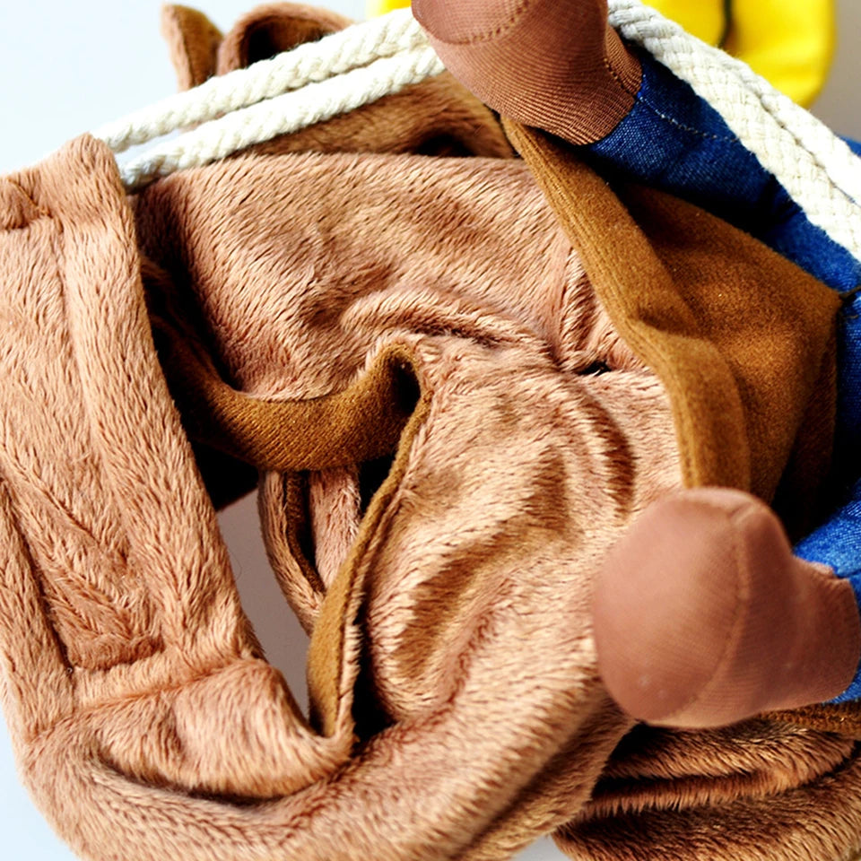 Close-up of a plush toy with soft, brown fur, white cord, and blue denim fabric. The toy appears to have limbs and a jacket with visible stitching details.