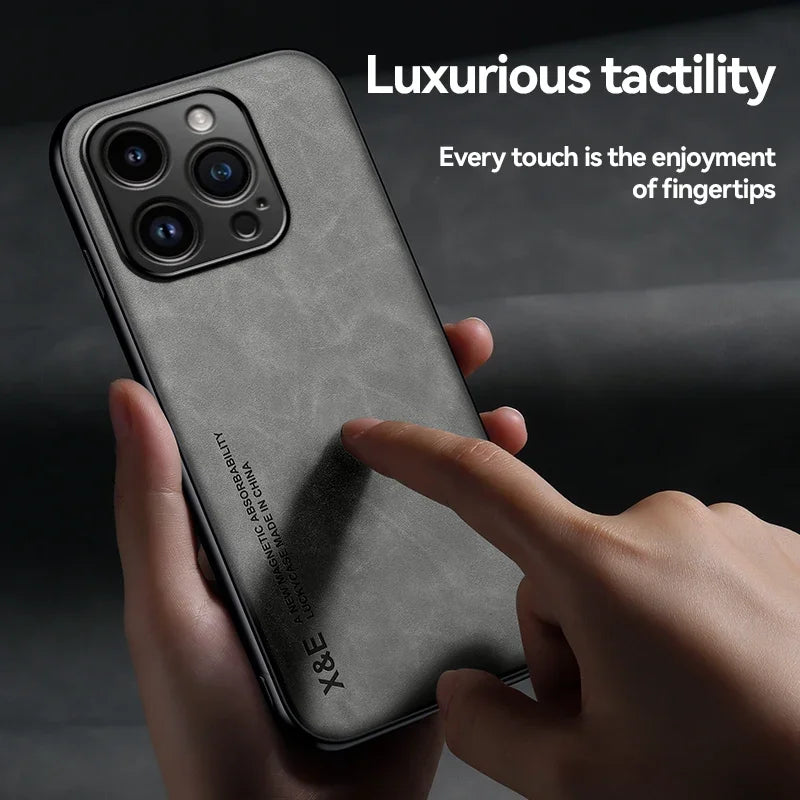 Close-up of a hand holding a smartphone with a textured black case. The case features the text "X&E" and "Magnetic Absorbability." The overlay reads, "Luxurious tactility."
