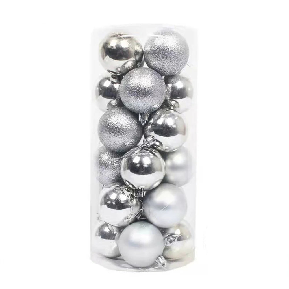 A clear cylinder contains a collection of glossy and glittery silver Christmas ornaments, neatly stacked, ready for holiday decoration.