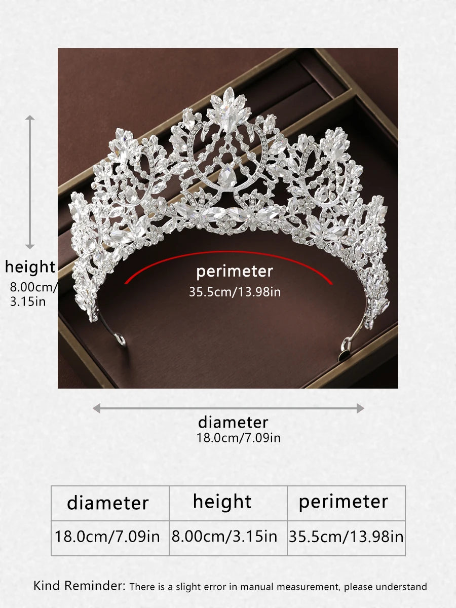 Intricate silver tiara with floral and leaf designs, measuring 18cm in diameter, 8cm in height, and a 35.5cm perimeter. Measurements might have slight errors.