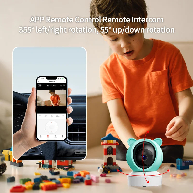 Child playing with building blocks near a blue bear-shaped camera, showcased with a phone app featuring a remote intercom and rotation controls for monitoring.