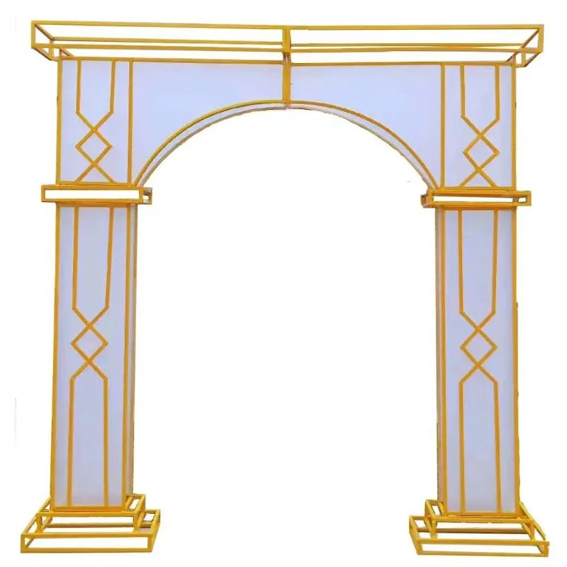 Gold and white decorative arch with geometric patterns and a central arched opening, ideal for ceremonies or events. The structure features two tall side pillars.