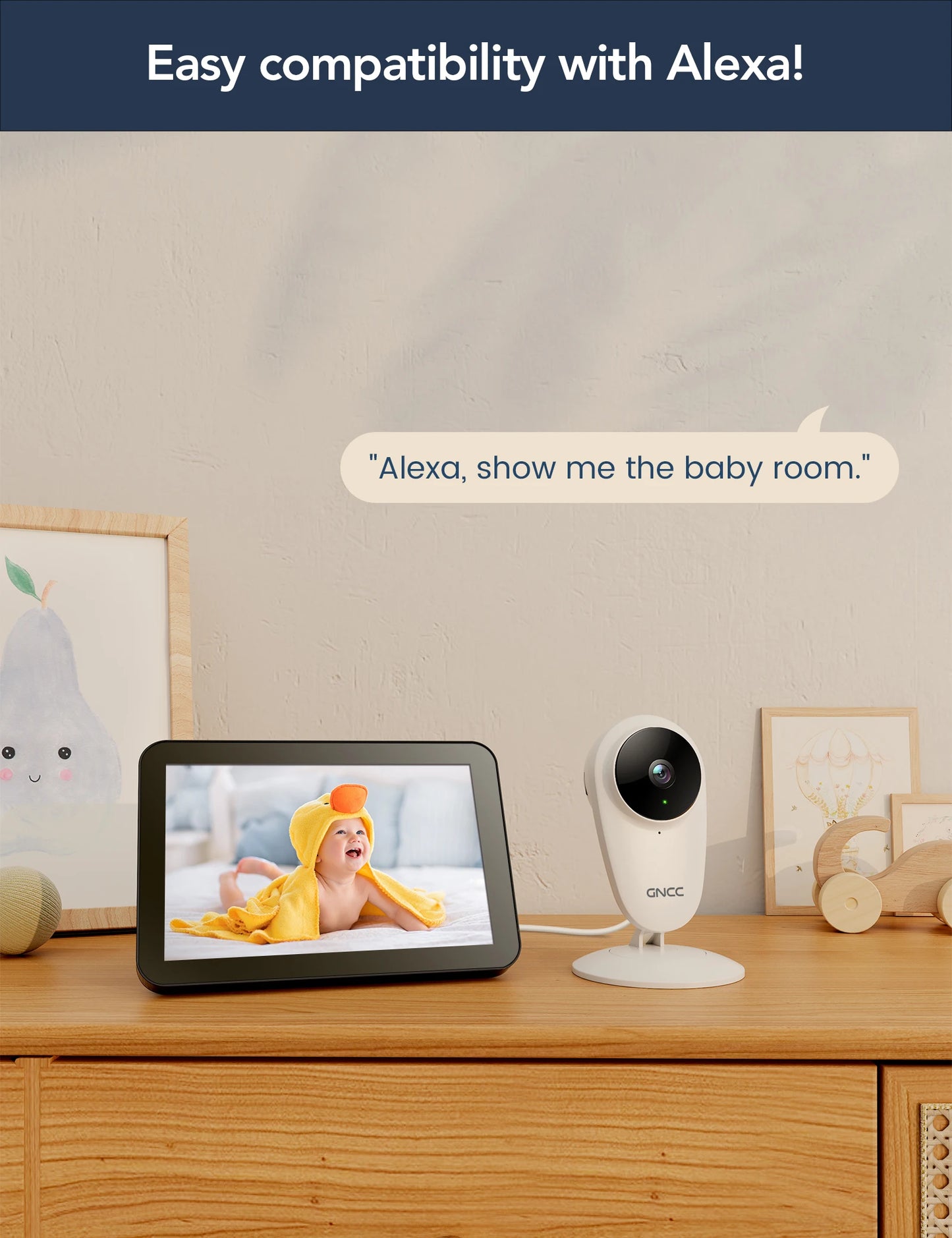 Smart display on wooden dresser, showing smiling baby in yellow towel; alongside a GNCC camera. Text reads: "Easy compatibility with Alexa!" and "Alexa, show me the baby room."