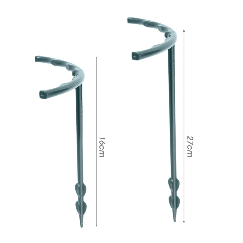 Two metal stakes are depicted with curved tops. One measures 16 cm and the other 27 cm, both featuring pointed ends and small spiral designs near the tips.