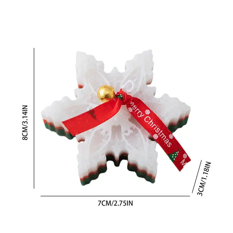 Snowflake-shaped soap with red, green layers, adorned with a red "Merry Christmas" ribbon and a small gold bell, dimensions 8cm x 7cm x 3cm.