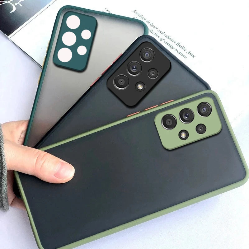 Three smartphones with green cases are fanned out. Each phone has a distinct camera layout on the back: a four-circle design, a quad lens, and another with a triple lens.