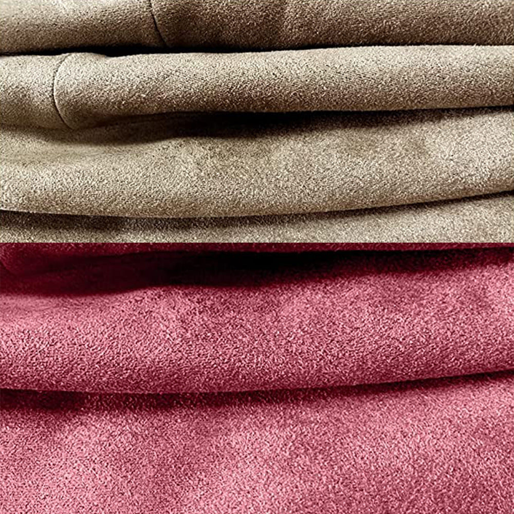 Close-up of stacked suede fabrics in beige and dark pink. The textures appear soft and plush, with the folds accentuating the material's thickness.