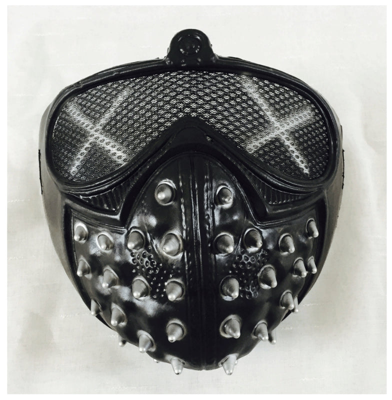 A black mask with mesh eye cover, silver spikes, and an "X" pattern. The design is edgy with a structured, studded look against a plain white background.