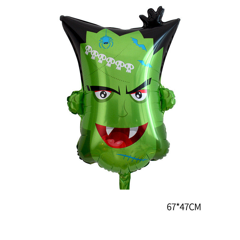 Green Halloween-themed balloon with a cartoon monster face, black hair, and a mischievous expression. Features skulls, bats, and a spider. Balloon size is 67x47 cm.