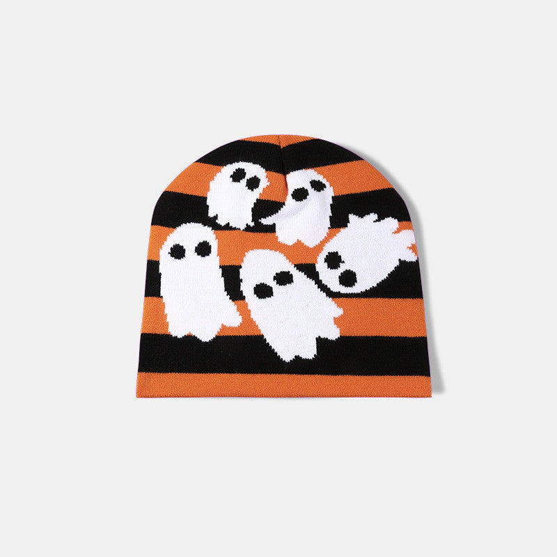 Orange and black striped beanie featuring cute white ghost designs with black eyes, against a light gray background.