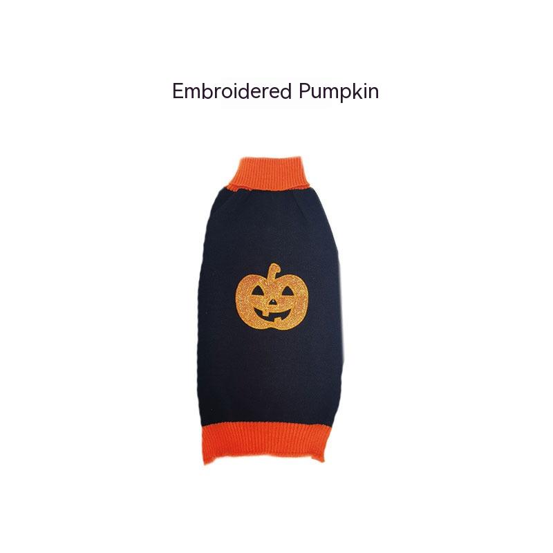 Black dog sweater with an embroidered pumpkin design, featuring orange trims on the neck and waist. Text above reads "Embroidered Pumpkin."