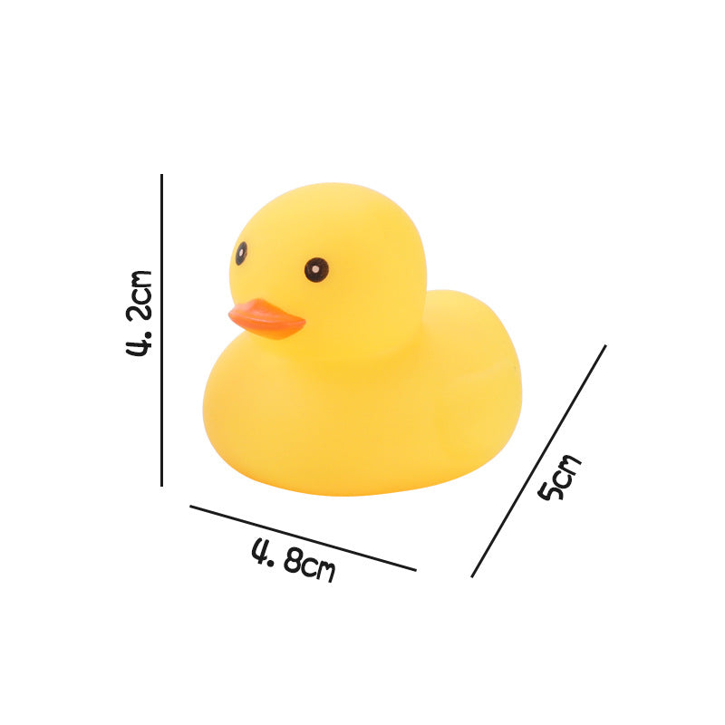 Yellow rubber duck with an orange beak, measuring 4.8cm in width, 5cm in length, and 4.2cm in height. The duck is facing slightly left with visible measurement lines.