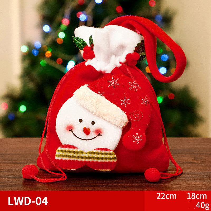 Red holiday gift bag with a snowman design, featuring a smiling face, fluffy hat, and scarf. Drawstring closure. Dimensions: 22cm x 18cm, weight: 40g. Festive lights in the background.