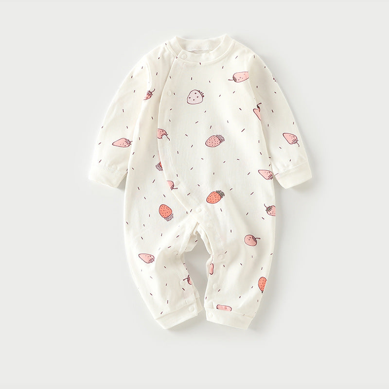 White baby romper with pink strawberry print, featuring long sleeves and snap buttons along the front and legs, displayed on a light gray background.