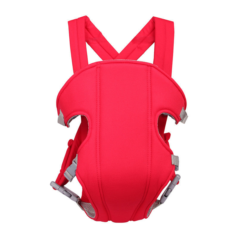 Red baby carrier with adjustable straps and buckles for secure fastening. The design includes leg openings and reinforced padding for comfort and support.