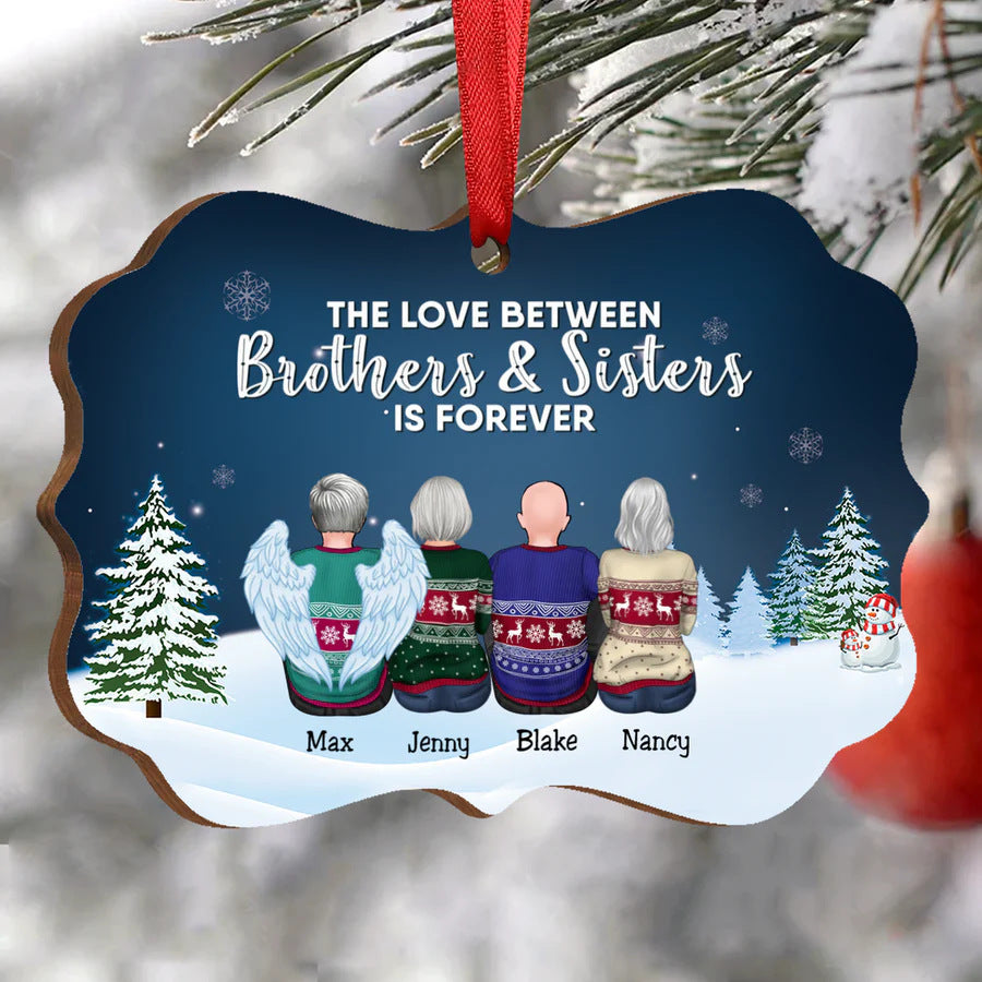 Wooden ornament with four figures in festive sweaters, labeled Max, Jenny, Blake, and Nancy. Snowy backdrop with trees. Text: "The love between brothers & sisters is forever."
