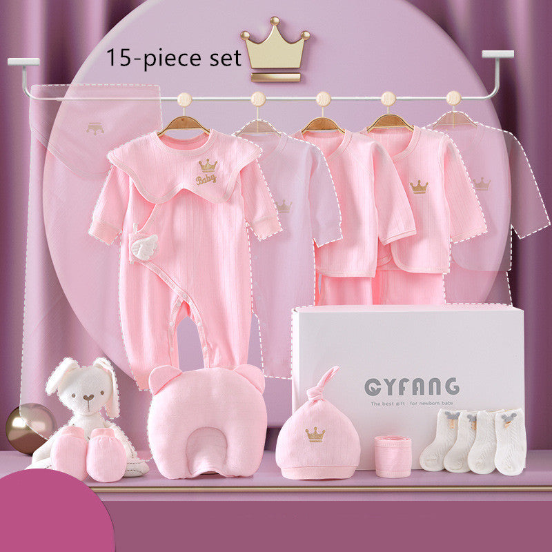 15-piece baby gift set with pink clothing, including onesies and hats, displayed on hangers. Comes with socks and a plush toy. Features a white gift box marked "CYFANG."