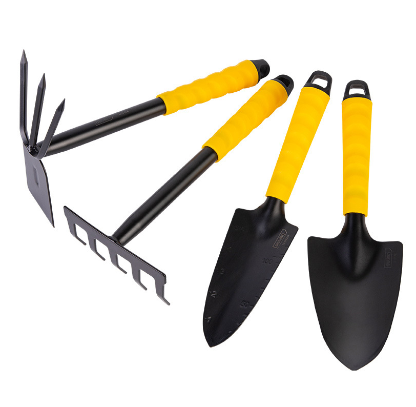 Four gardening tools with black heads and yellow handles: a fork, a rake, a pointed trowel with measurements, and a rounded trowel, arranged neatly on a white background.