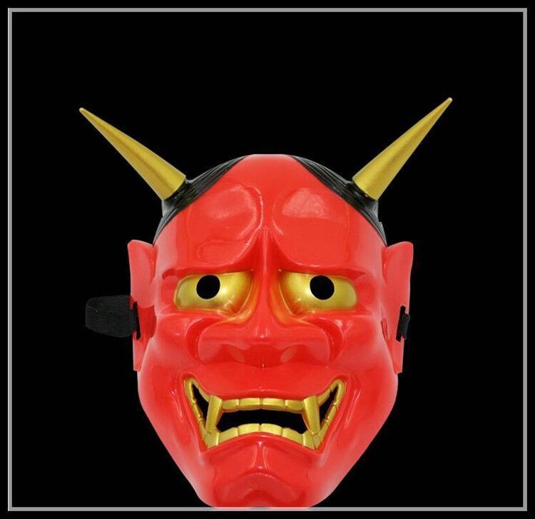 Red mask with a fierce expression, featuring exaggerated gold eyes, sharp teeth, and two long yellow horns, set against a black background.