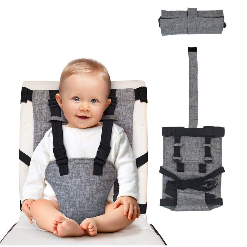A smiling baby is secured in a gray fabric travel high chair harness with black straps. The harness is shown folded and laid out separately on the right.