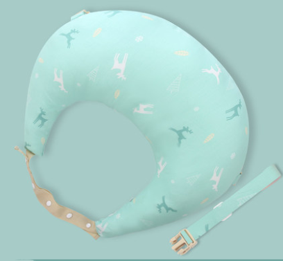 Mint green baby nursing pillow with a nature-themed pattern featuring animals and trees. It has an adjustable strap for support and a matching detachable belt.