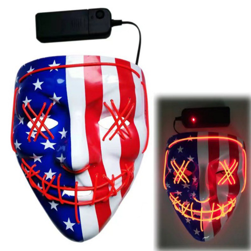 Mask with American flag design, features red LED lights outlining eyes and mouth, creating an 'X' pattern. A battery pack is attached via a cord. Inset shows mask glowing in the dark.