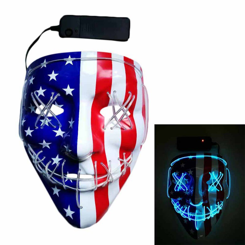 Lit-up mask with American flag design, featuring blue stars and red stripes. The mask has X-shaped LED eyes and smile, with a battery pack. Inset shows it glowing in the dark.