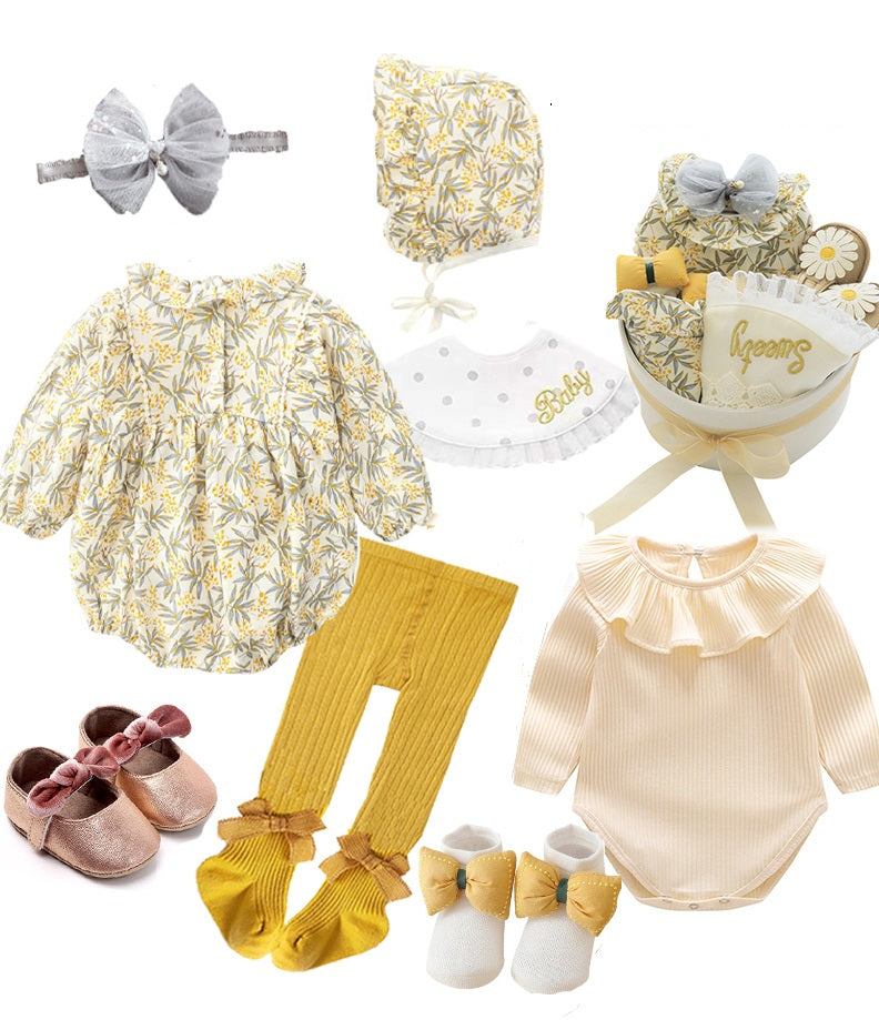 Assorted baby clothes and accessories featuring floral romper, bonnet, yellow leggings, beige onesie, socks, shoes, headband, and gift package with "Sweet" text, in yellow and grey tones.