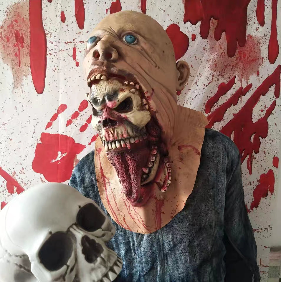 Horror-themed figure with a grotesque face and skeletal mouth stands against a blood-splattered background, holding a skull.