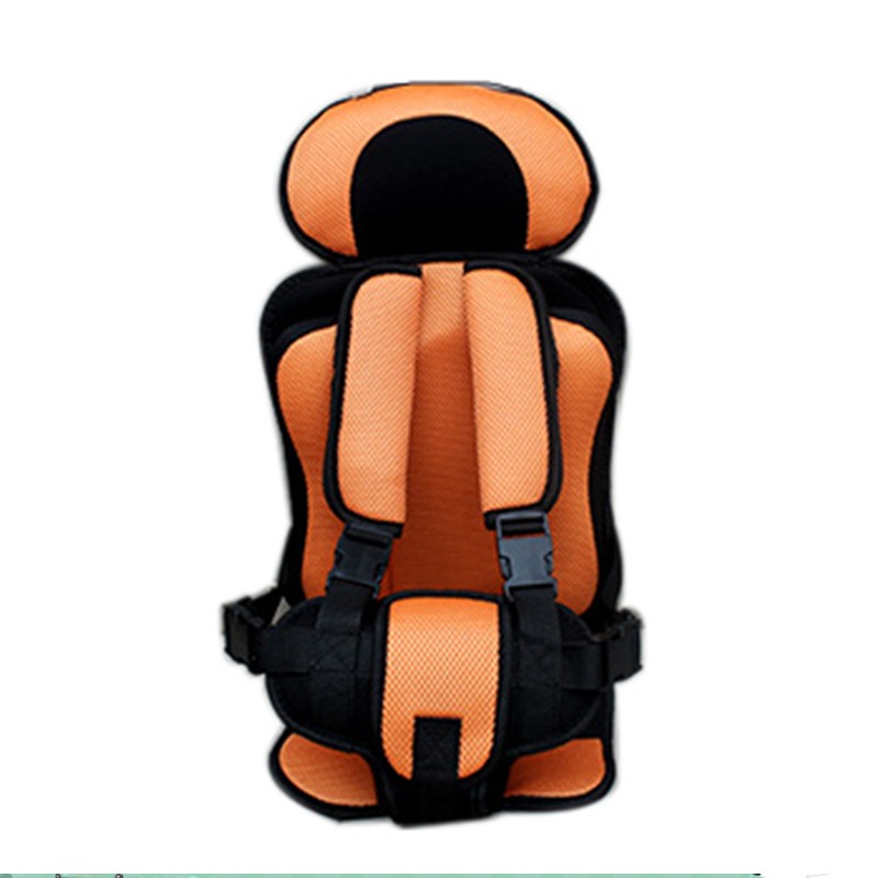 Orange and black child safety seat with padded cushions, adjustable headrest, and secure black straps for harnessing. Designed for comfort and protection during travel.