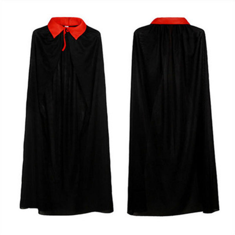 Black cape with a striking red collar displayed from the front and back. The front view shows a red tie beneath the collar. The fabric appears smooth and flowing, suitable for a costume or formal attire. The cape is long, extending down to the ankles, providing dramatic flair.