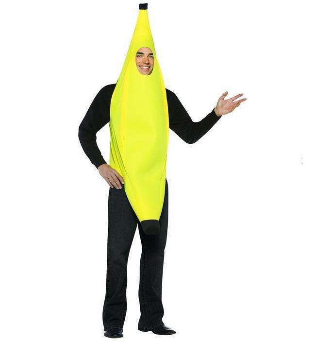 Person in a banana costume with arms and face visible, wearing black long sleeves and pants, standing and smiling with one arm extended.
