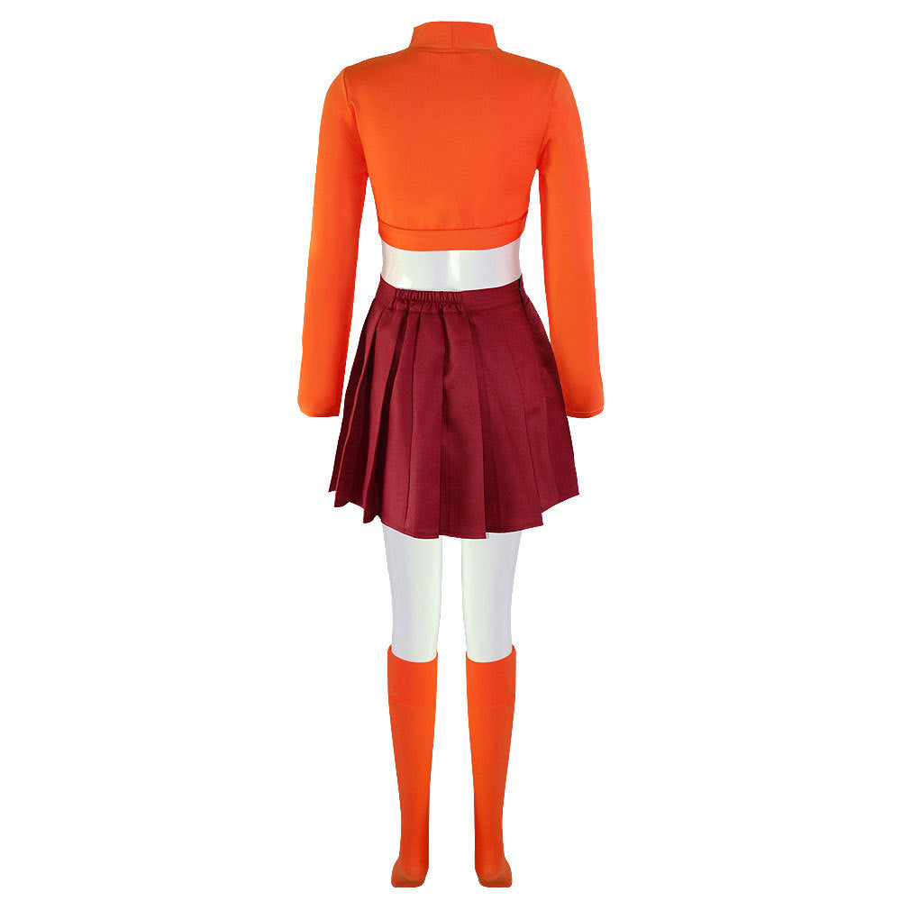 Mannequin wearing an orange long-sleeve crop top, maroon pleated mini skirt, and matching orange knee-high socks, viewed from the back against a white background.