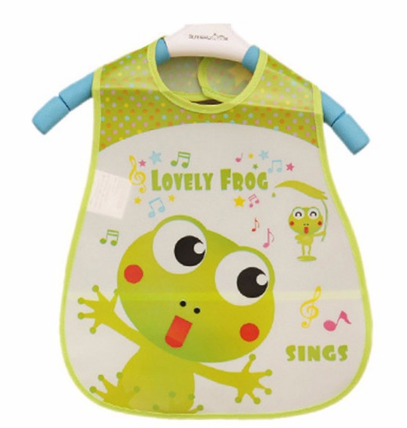 Children's bib with a cheerful green frog design, "Lovely Frog Sings" text, surrounded by colorful musical notes. Green trim and blue shoulder straps complete the playful look.