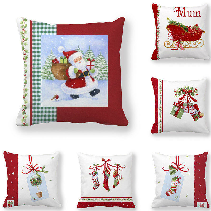 Festive cushions featuring Santa with gifts and various Christmas designs: a sleigh with "Mum," hanging presents, mistletoe, and stockings. Red, white, and green accents.
