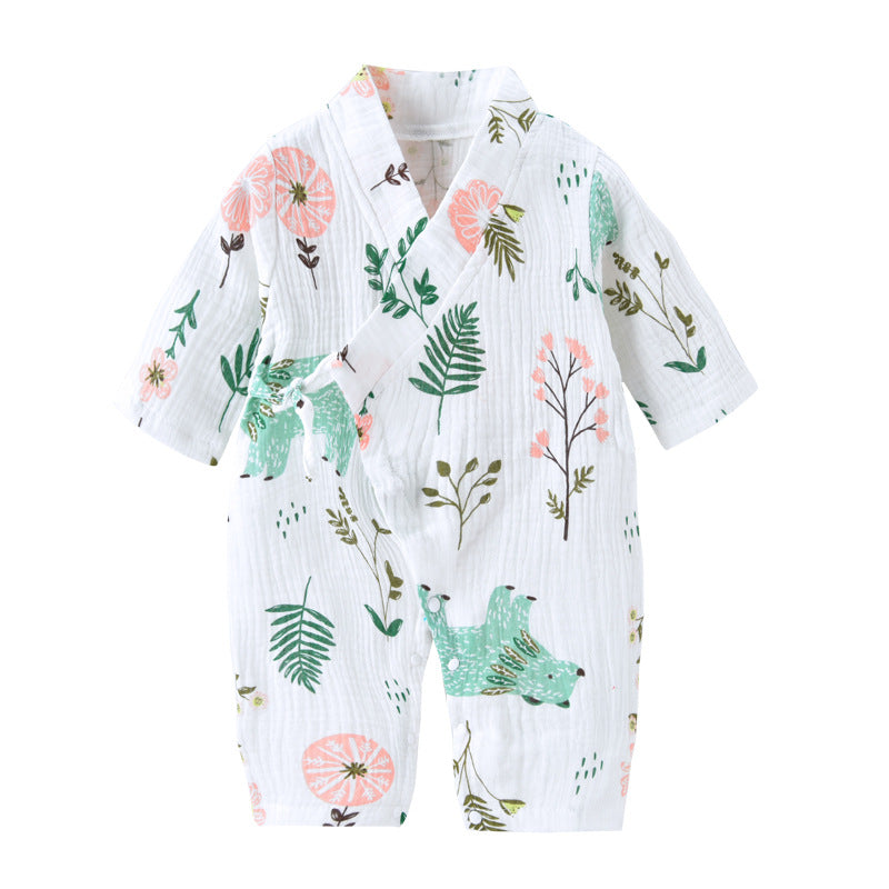 White baby romper with long sleeves, featuring a floral and leaf pattern in pink, green, and brown. The wrap-style neckline is accented with a small fabric bow.