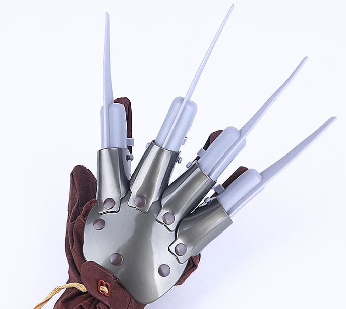 Glove with long metallic claws and brown fabric base, featuring five extended fingers in a fan shape on a white background, resembling a fictional character's weapon.