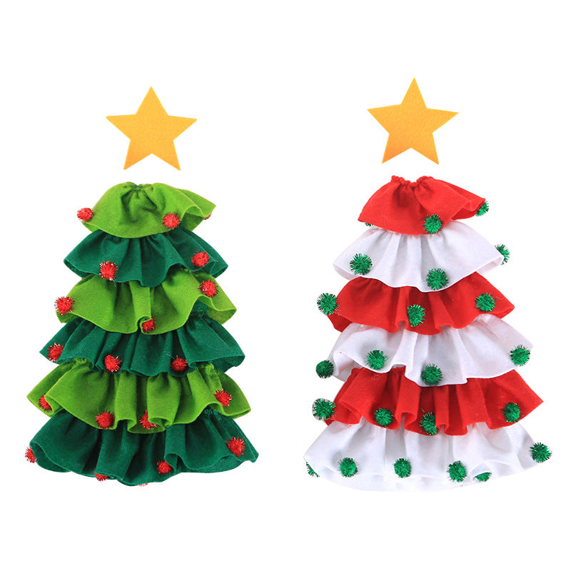 Two felt Christmas trees: one green with red pom-poms, the other red and white with green pom-poms. Both topped with yellow stars.