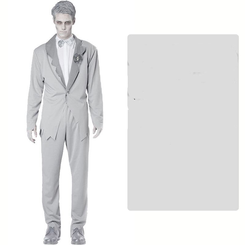 Man dressed as a zombie groom in a gray suit with a bow tie and flower boutonniere. His face and hair are ashen to match the undead theme, standing against a plain background.