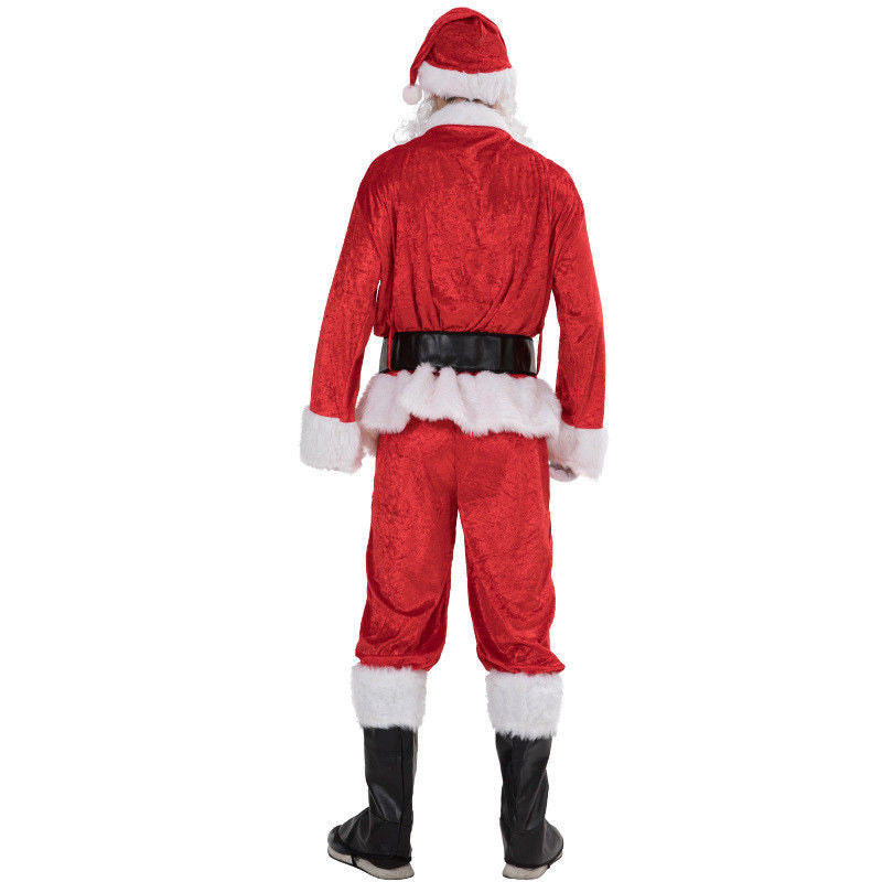 Rear view of a person in a Santa Claus costume, featuring a red suit with white trim, black belt, and boots, topped with a Santa hat, standing against a plain background.