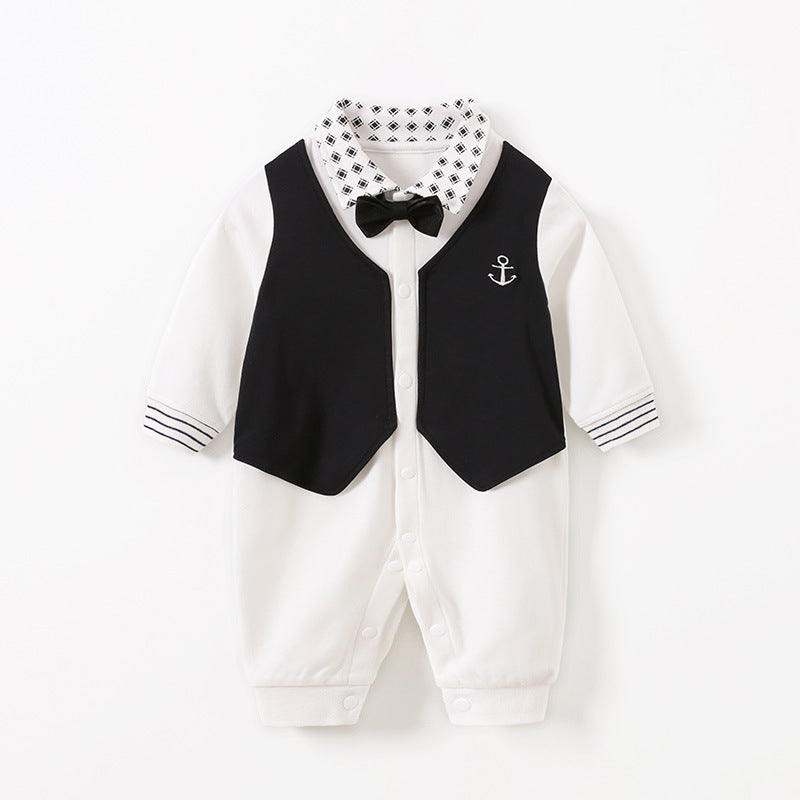 White baby romper with black faux vest, embroidered anchor, and black bow tie. Features a patterned collar and striped cuffs. Snaps along the front and legs for easy dressing.