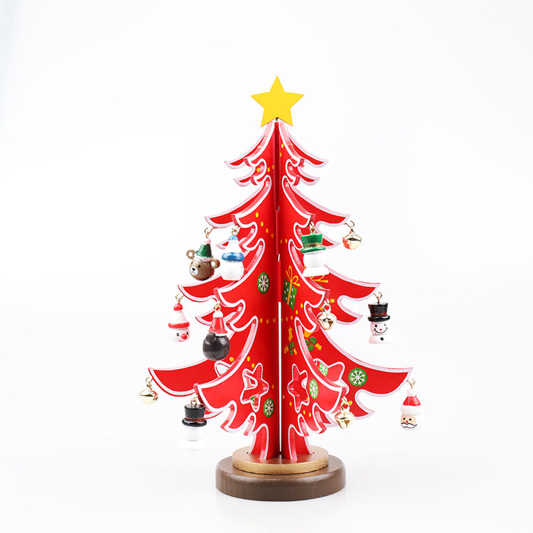 Red Christmas tree with a yellow star on top, decorated with festive ornaments including snowmen, Santa, gifts, and bells, standing on a round brown base.
